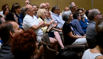 congregants gather for a community sing-along