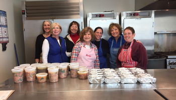 caring community prepares meals in TBE kitchen